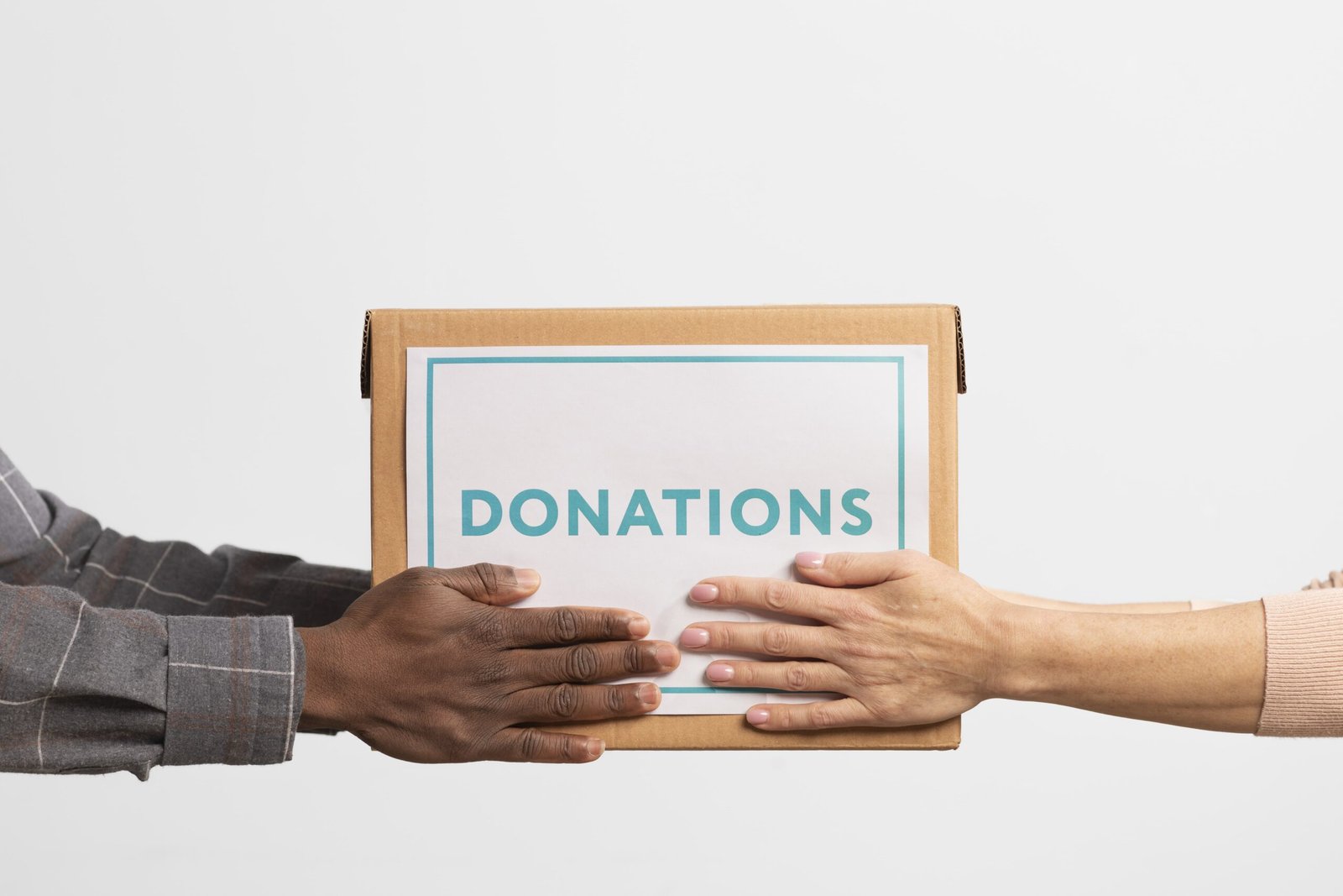 volunteer-giving-box-with-donations-another-volunteer-min